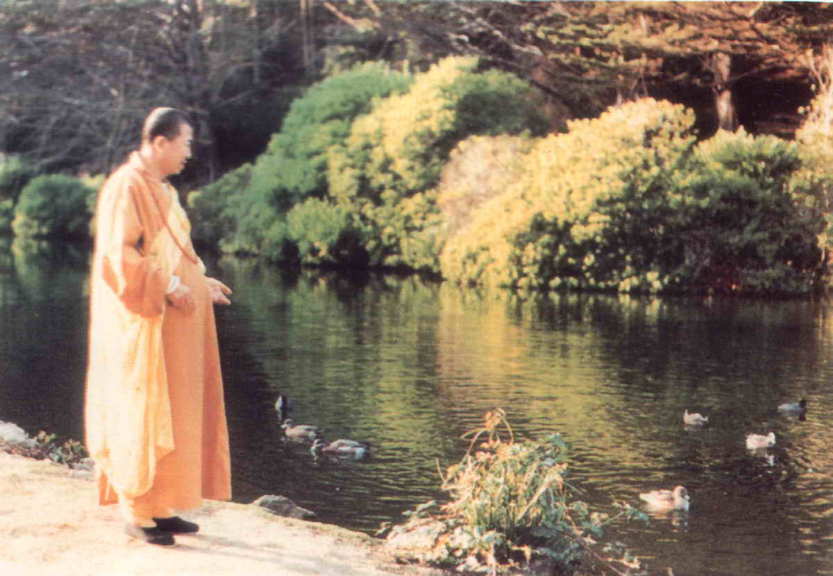 Master Hua by a pond in San Francisco, early 1960s